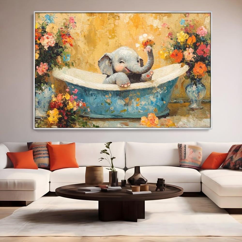 Tablou canvas cu tablou canvas cu pui de elefant in cada, in rama de aluminiu argintiu, pe perete intr-un living